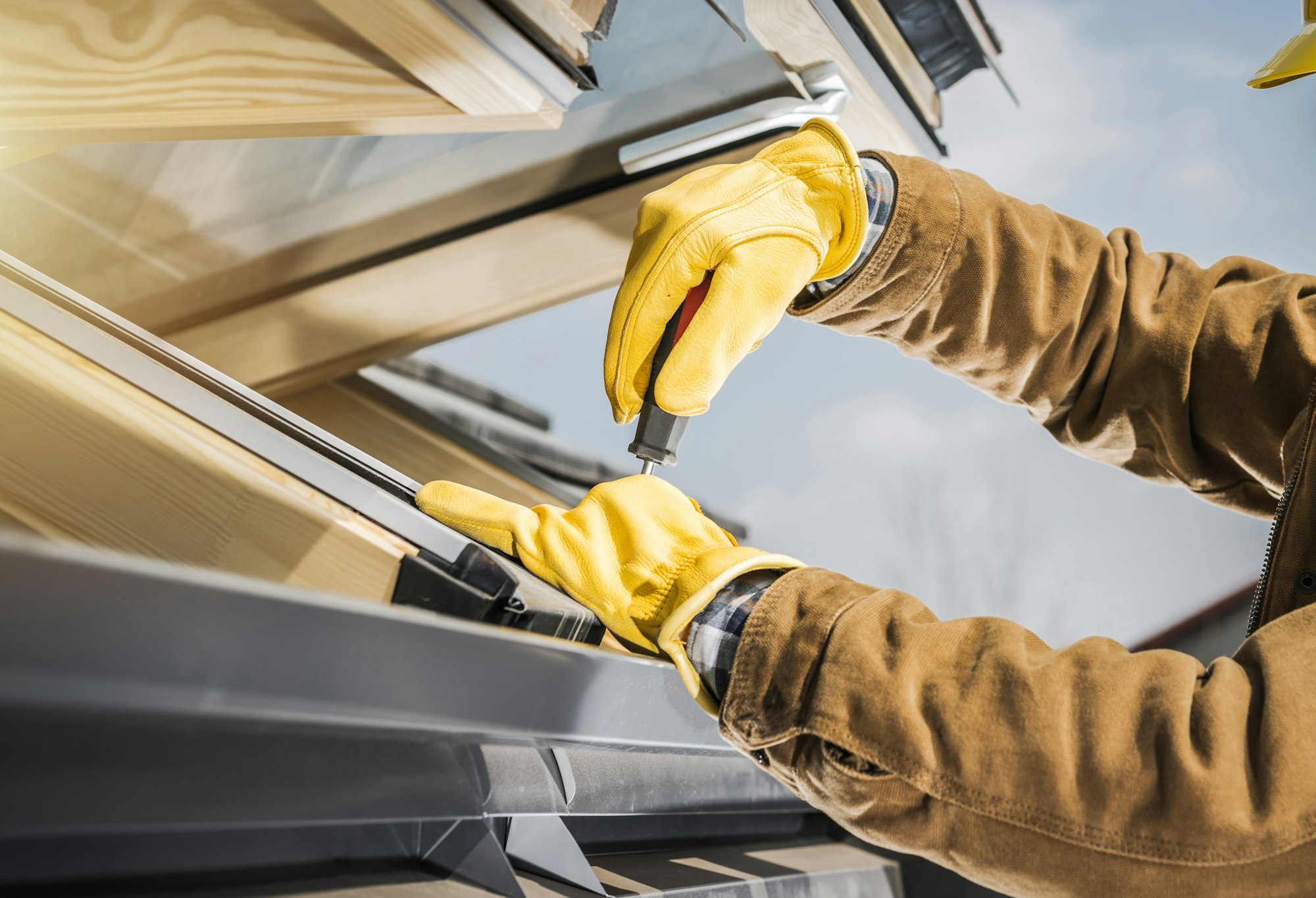 Modern Wooden Roof Window Installation Performed by Professional Worker